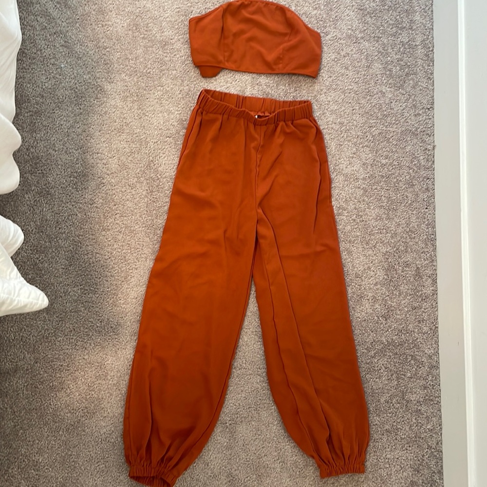 Rustic orange two piece. Size small. US 4